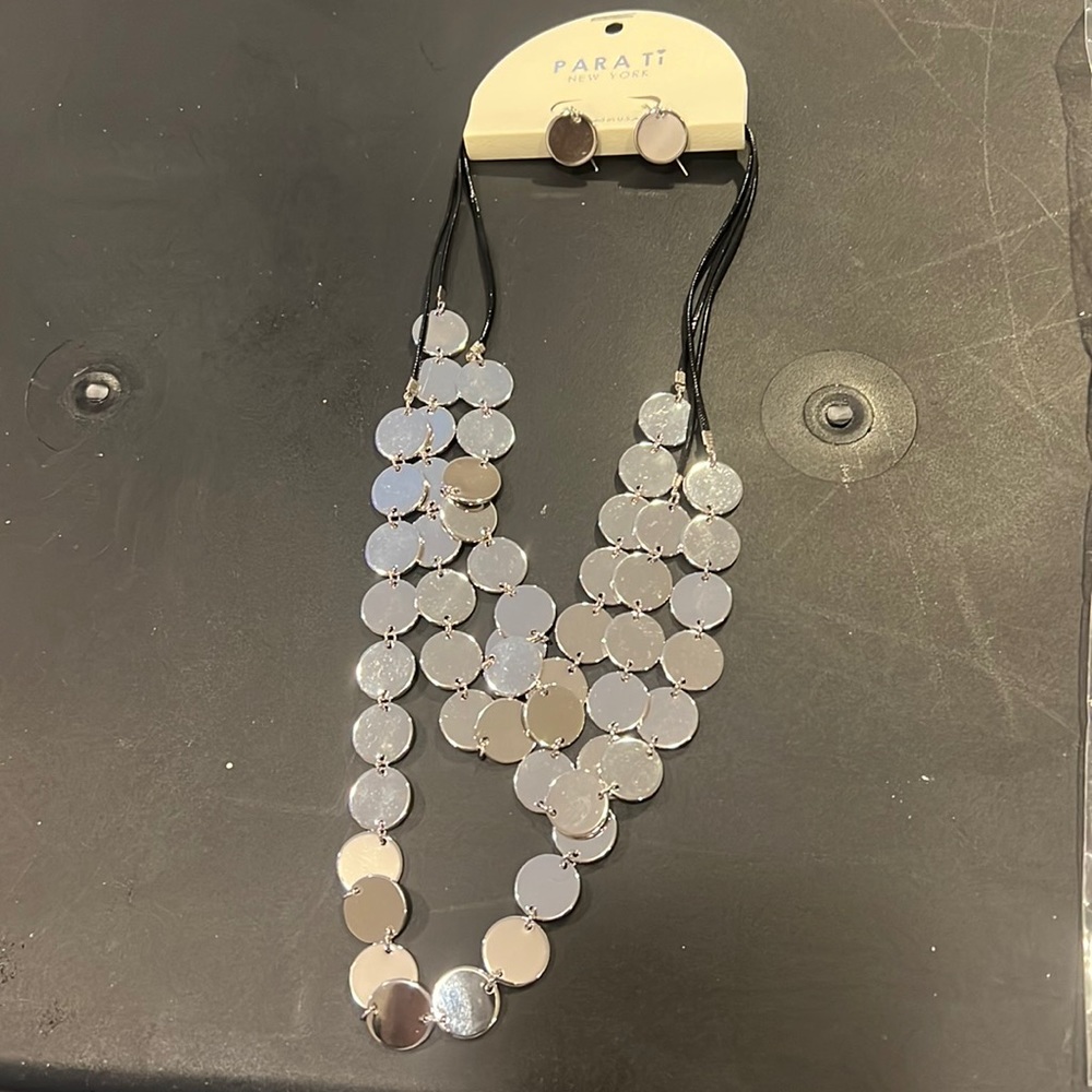 Brand new silver necklace and earrings set.